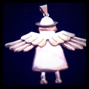 Ladies sterling silver and brass pendant